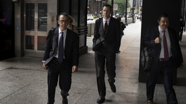 Michael Nowak, former head of precious-metals trading for JPMorgan Chase & Co., center, arrives at federal court in Chicago, Illinois, US, on Friday, July 8, 2022. Nowak and two of his former colleagues face criminal charges for thousands of so-called spoofing trades, which prosecutors say were used for years to generate illicit gains for JPMorgan and its top clients.