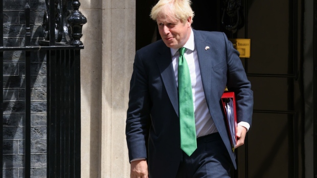 Boris Johnson departs 10 Downing Street to attend a weekly questions and answers session at Parliament on July 13. Photographer: Hollie Adams/Bloomberg