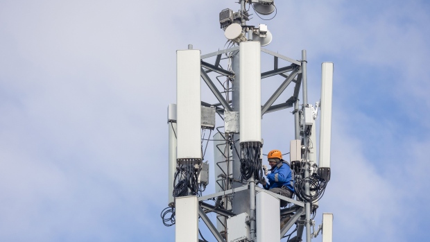 An engineer performs maintenance on a Service-Telecom LLC telecommunication network mast in St Petersburg, Russia, on Monday, Sept. 27, 2021. Service-Telecom will acquire 100% of Veon’s National Tower Co. unit, which operates about 15,400 mobile towers in Russia, for 70.7 billion rubles ($970 million), continuing to provide services under a long-term agreement, Veon said in statement. Photographer: Andrey Rudakov/Bloomberg