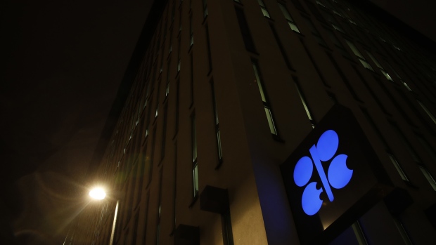 An OPEC sign hangs outside the OPEC Secretariat as night falls during the 175th Organization Of Petroleum Exporting Countries (OPEC) meeting in Vienna, Austria, on Thursday, Dec. 6, 2018. The Organization of Petroleum Exporting Countries and its allies are desperate to shore up oil prices after a slump of more than $20 a barrel since October.