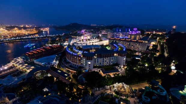 The Resorts World Sentosa integrated resort and casino complex, operated by Genting Singapore Plc., stands illuminated at dusk in Sentosa Island in Singapore, on Saturday, June 9, 2018. U.S. President Donald Trump and North Korean leader Kim Jong Un will hold their historic Singapore summit at the Capella Hotel on the city-states Sentosa Island on June 12.