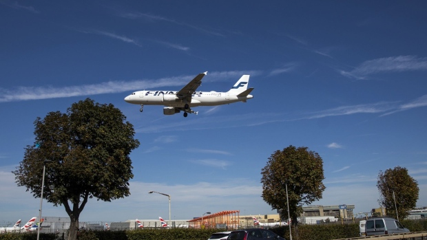 A passenger aircraft operated by Finnair Oyj comes into land at London Heathrow Airport in London, U.K., on Friday, Sept. 13, 2019. Climate activists were planning to fly toy drones near Heathrow Friday as part of a campaign to draw attention to an expected increase in greenhouse gas emissions from a planned expansion of the airport. Photographer: Chris Ratcliffe/Bloomberg