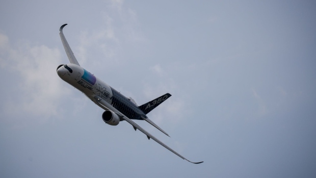 An Airbus SE A350 aircraft during an aerial display on the opening day of the Farnborough International Airshow in Farnborough, UK, on Monday, July 18, 2022. The airshow, one of the biggest events in the global aerospace industry, runs through July 22.