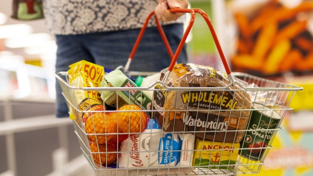 A basket of staple food items at an Iceland Foods Ltd. supermarket in Christchurch, UK, on Wednesday, June 15, 2022. "Britain's cost-of-living crisis -- on track to big the biggest squeeze since the mid-70s -- will continue to worsen before it starts to ease at some point next year," said Jack Leslie, senior economist at the Resolution Foundation, a research group campaigning against poverty. Photographer: Chris Ratcliffe/Bloomberg
