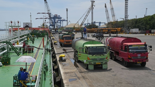 Palm oil loaded into trucks from a tanker docked at Tanjung Priok Port in Jakarta, Indonesia, on Tuesday, April. 26, 2022. 
    After a shock announcement by Indonesia late Friday about banning all exports of cooking oil, the world’s top producer clarified days later that it will only halt exports of RBD palm olein, while shipments of crude palm oil can continue.