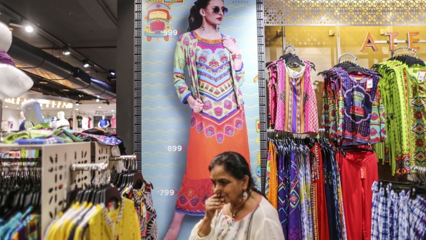 An advertisement for women's clothes is displayed at a Big Bazaar hypermarket, operated by Future Retail Ltd., in Mumbai, India, on Sunday, April 16, 2017. Future Retail, India's biggest department store chain, still has room to extend the rally that's more than doubled its market value this year. A shortage of cash hit purchases of soaps to cars after Prime Minister Narendra Modi in November junked high-value currency bills, driving shoppers to large-format stores like Future Retail that accept credit cards. Photographer: Dhiraj Singh/Bloomberg