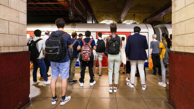 Passengers wait on the platform at Baker Street London Underground station during a heat wave in London, U.K., on Tuesday, July 19, 2022. Temperatures in the UK hit a record Tuesday as the heat wave disrupts travel, business and schools, and poses a risk to lives across the country.