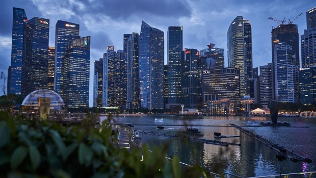 Buildings illuminated at dusk in the central business district (CBD) of Singapore, on Thursday, Jan. 28, 2021. HSBC Holdings Plc plans to accelerate its expansion across Asia in its imminent strategy refresh, Chairman Mark Tucker told the virtual Asian Financial Forum last week. Photographer: Lauryn Ishak/Bloomberg