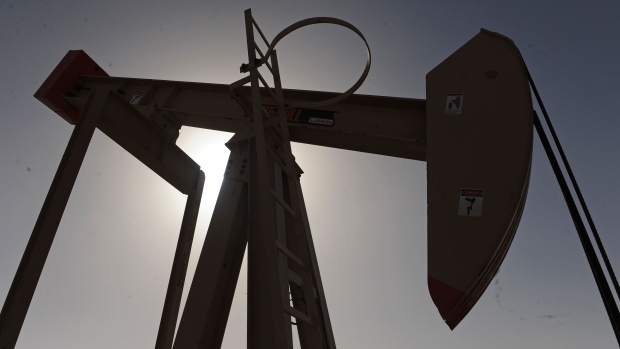 An oil pump, also known as a "nodding donkey," is seen operating in the Awali oil field in Bahrain, on Tuesday, Feb. 22, 2011. Anti-government riots that started in Tunisia before erupting in Egypt, Yemen, Libya, Algeria, Iran and Bahrain have sent crude to a 28-month high. Bloomberg