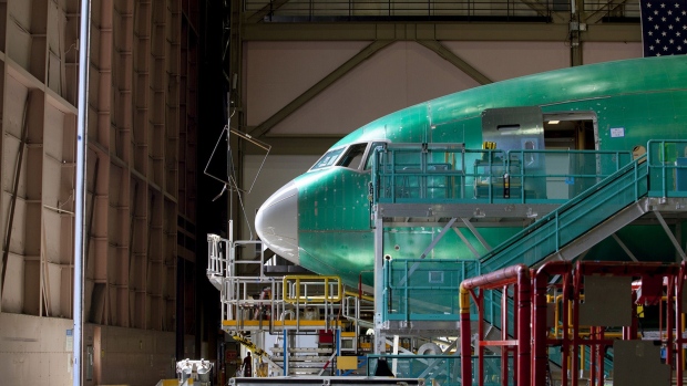 A nearly completed Boeing Co. 777 reaches the end of a moving production line at the company's facility in Everett, Washington.