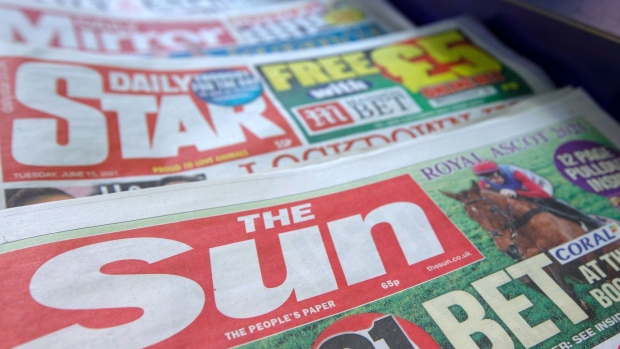 Copies of The Sun newspaper, alongside other tabloid titles, inside a newsagent in London, U.K., on Tuesday, June 15, 2021. Rupert Murdoch’s News Corp. wrote down the value of its once high-flying Sun title to zero, underscoring the dramatic decline in Britain's newspaper industry.