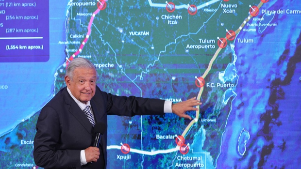 Andres Manuel Lopez Obrador points to a map with the route of the Mayan Train that is under construction during the daily briefing at Palacio Nacional on June 28, 2022 in Mexico City.