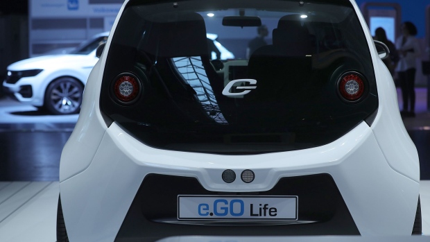 A test driver drives an e.Go Life electric compact automobile, manufactured by e.Go Mobile AG, installed with electric drive systems developed by Robert Bosch GmbH, during the Bosch mobility experience in Boxberg, Germany, on Tuesday, July 4, 2017. Auto supplier Bosch will build a 1 billion-euro ($1.1 billion) semiconductor plant, the biggest single investment in its history, as the maker of brakes and engines prepares for a surge in demand for components used in self-driving vehicles.