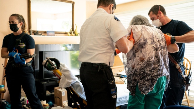 EMTs prepare to transport an elderly patient who may have had a stroke in Shoreline, Washington on July 26, 2022.