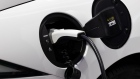 A ClipperCreek Inc. charging plug is seen connected to a General Motors Co. (GM) Chevrolet Volt electric vehicle (EV) at a charging station in Los Angeles, California, U.S., on Tuesday, July 11, 2017. City Council committee signed off financing for a program to provide more than $1.1 million in funding to add dozens of EV charging stations around the city in addition to the 560 already in place at city facilities and street locations.
