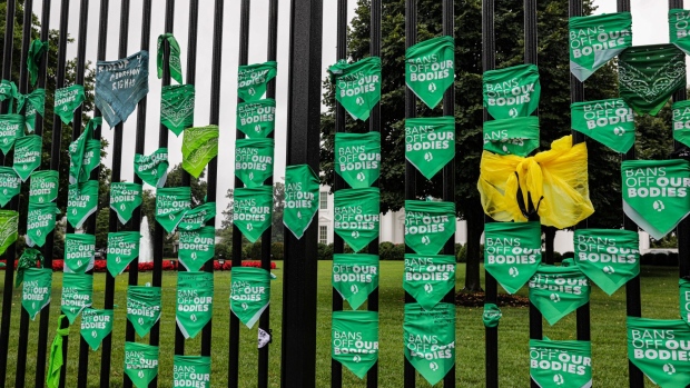 Abortion rights bandannas on a fence outside the White House during a Women's March rally in Washington, D.C., US, on Saturday, July 9, 2022. President Biden yesterday signed an executive order intended to preserve access to abortion following last month's Supreme Court's decision to overturn Roe v. Wade.