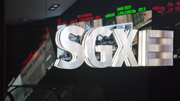 Singapore Exchange Ltd. (SGX) signage stands inside the bourse's headquarters in Singapore, on Thursday, Jan. 19, 2017. The SGX has tendered a 4.75% stake in the Bombay Stock Exchange for sale in an initial public offer, valuing its shares at S$42.8m to S$42.9m, the exchange said in a filing Jan. 19. Photographer: Ore Huiying/Bloomberg