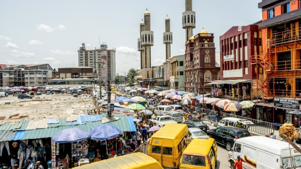 Heavy traffic surrounds the roads by a market in Lagos, Nigeria, on Friday, April 22, 2022. Choked supply chains, partly due to Russia’s invasion of Ukraine, and an almost 100% increase in gasoline prices this year, are placing upward price pressures on Africa’s largest economy. Photographer: Damilola Onafuwa/Bloomberg