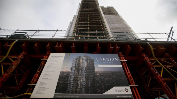 A billboard at the Adler Group SA Uberlin luxury apartment construction site in Berlin, Germany, on Tuesday, Nov. 2, 2021. A major landlord in Germany, Adler has aggressively sold assets to help prop up its balance sheet, putting about 40% of the company’s portfolio on the block. Photographer: Krisztian Bocsi/Bloomberg