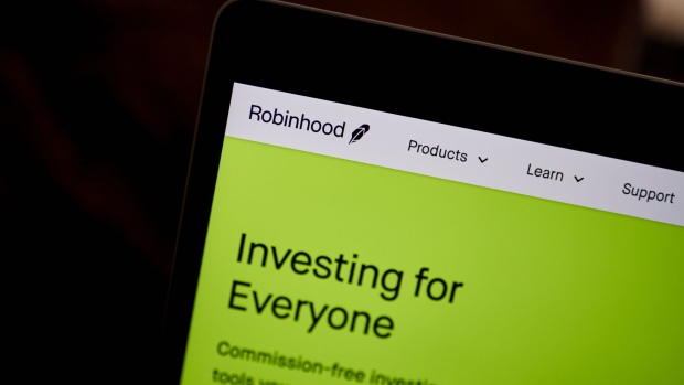 The Robinhood website home screen on a laptop computer arranged in the Brooklyn borough of New York, U.S., on Saturday, Dec. 19, 2020. Robinhood Markets will pay $65 million to settle allegations that it failed to properly inform clients it sold their stock orders to high-frequency traders and other firms, putting a major compliance headache behind the brokerage even as new ones emerge. Photographer: Gabby Jones/Bloomberg