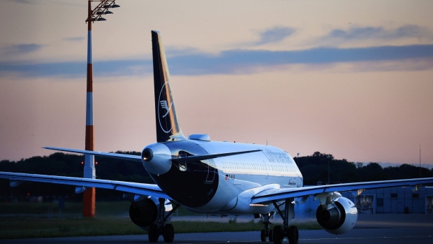 A passenger aircraft, operated by Deutsche Lufthansa AG, prepares to take-off at Munich International Airport in Munich, Germany, on Saturday, June 25, 2022. Although travel demand has rebounded dramatically in Europe, what had been touted as the aviation industry's long-awaited post-pandemic revival is being constrained by labor strife and limits in airport logistics. Photographer: Krisztian Bocsi/Bloomberg