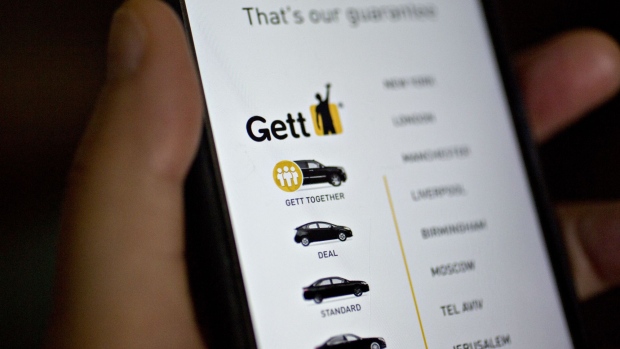 The Gett Inc. application is displayed for a photograph on an Apple Inc. iPhone in Washington, D.C., U.S., on Thursday, April 27, 2017. Two small ride-hailing companies are combining in an effort to slow the march of Uber Technologies Inc. around the globe. Tel Aviv-based Gett said its paying $200 million to acquire Juno, a New York startup that endeared itself to drivers by offering company stock and better pay than Uber.