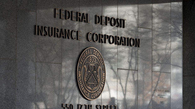 Signage hangs outside the Federal Deposit Insurance Corporation (FDIC) headquarters in Washington, D.C., U.S., on Thursday, Jan. 2, 2020. The federal appeals court in Manhattan today said the government may pursue insider-trading charges under a newer securities-fraud law not subject to a key requirement of the statute prosecutors traditionally use. Photographer: Andrew Harrer/Bloomberg