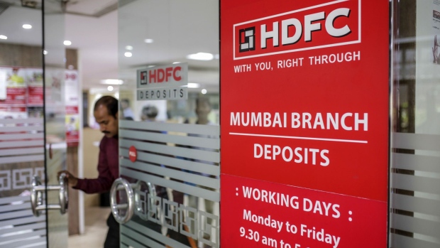 A customer exits a Housing Development Finance Corp. (HDFC) bank branch in Mumbai, India, on Monday, June 3, 2019. The Reserve Bank of India rate decision is scheduled for June 6.