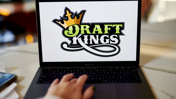 The logo for DraftKings is displayed on a laptop computer in an arranged photograph taken in Little Falls, New Jersey, U.S., on Wednesday, Oct. 7, 2020. The pricing of a DraftKings Inc. share sale combined with a fresh wave of Covid-19 infections across the National Football League sent shares of the online gaming company tumbling this week. Photographer: Gabby Jones/Bloomberg