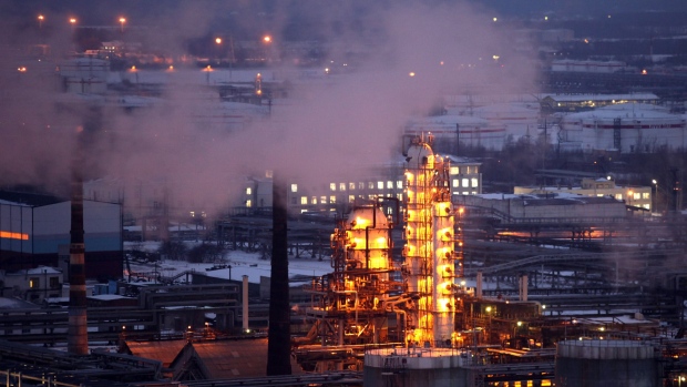 Petroleum cracking towers are seen illuminated by lights at the Lukoil-Nizhegorodnefteorgsintez petroleum refinery, operated by OAO Lukoil, in Nizhny Novgorod, Russia.