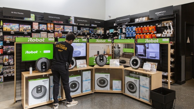 An employee cleans an iRobot Corp. Roomba display inside an Amazon.com Inc. 4-star store in Berkeley, California, U.S., on Friday, March 29, 2019. Amazon's new franchise of retail stores, called Amazon 4-star, stock a potpourri of items with positive reviews on the company's online retail site.