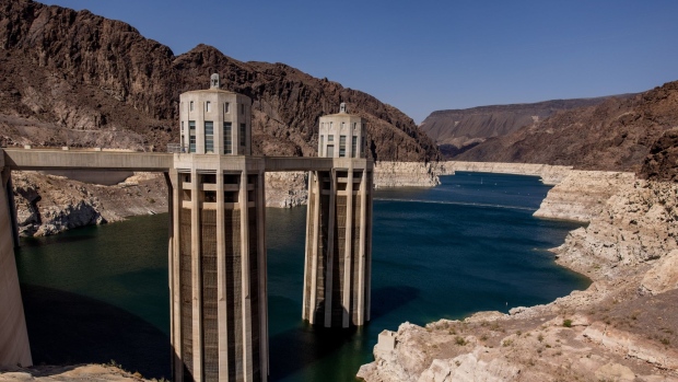 Intake towers during low water levels at the Hoover Dam on the Colorado River in Arizona, Nevada, U.S., on Thursday, Aug. 19, 2021. Federal officials ordered the first-ever water cuts on the Colorado River system that sustains 40 million people, the latest blow from a decades-long drought across the U.S. West that has shrunk reservoirs to historic lows, devastated farms and set the stage for deadly forest fires. Photographer: Roger Kisby/Bloomberg