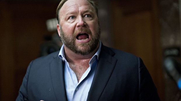 Alex Jones, radio host and creator of the website InfoWars, speaks to members of the media outside a Senate Intelligence Committee hearing in Washington, D.C., U.S., on Wednesday, Sept. 5, 2018. Lawmakers from both sides of the aisle have increased pressure on technology companies on Russian interference in the 2016 presidential campaign and other election meddling as well as issues including alleged anti-conservative bias and antitrust questions.