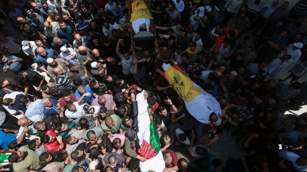 Mourners attend the funerals of Palestinians killed in recent Israeli air strikes in Gaza, on Aug. 07, 2022.