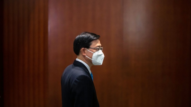 John Lee, Hong Kong's chief executive, following a Question and Answer session in the chamber of the Legislative Council in Hong Kong, China, on Wednesday, July 6, 2022. Hong Kong must not "lie flat" in its battle with Covid-19, Lee said, echoing mainland China's rejection of the "living with the virus" pandemic policy.