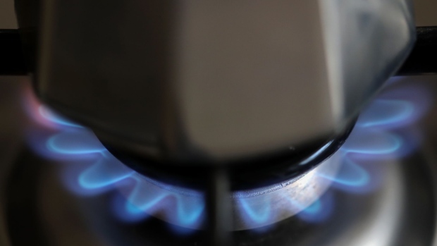 Natural gas burns on a domestic kitchen stove in Rome, Italy, on Wednesday, Dec. 29, 2021. European gas prices declined to near the lowest level in three weeks, with increased inflows at terminals in the region bringing relief to the tight market. Photographer: Alessia Pierdomenico/Bloomberg