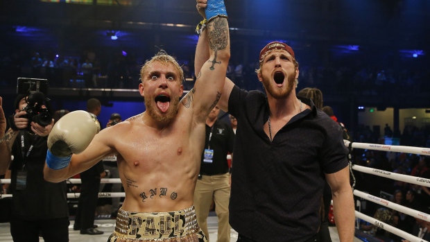 Jake Paul celebrates with his brother, Logan, after defeating AnEsonGib in a first round knockout during their fight at Meridian at Island Gardens on January 30, 2020 in Miami.