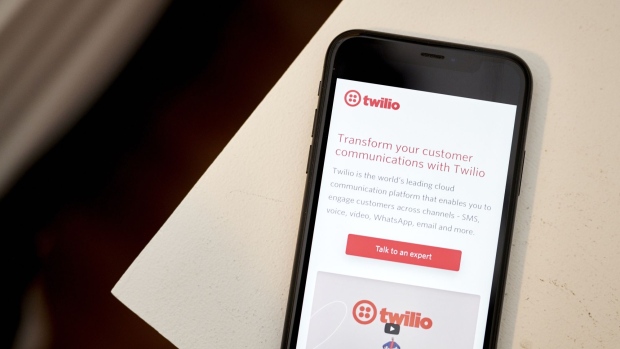The website home screen for Twilio on a smartphone arranged in the Brooklyn borough of New York.