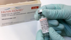 A health care worker handles a used vial of the Novavax Inc. Nuvaxovid Covid-19 vaccine at the Tegel Vaccine Center in Berlin, Germany, on Monday, March 7, 2022. There are hopes that Nuvaxovid could boost vaccination efforts that have flagged among the hesitant, according to Novavax, as the jab uses a technology which some people might find more appealing.