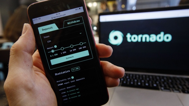 The Tornado Cash website displayed on a laptop and smartphone screen arranged in London, U.K., on Tuesday, March 15, 2022. Crypto protocols that allow digital-asset traders to obfuscate their transaction activity should be more regulated, the U.K.’s National Crime Agency said.