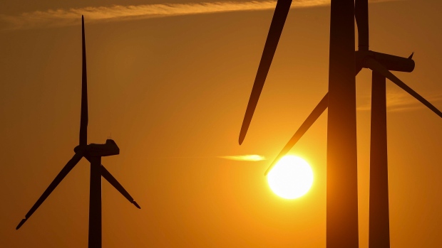 Wind turbines operated by RWE AG during sunset in Rheinisches Revier, Germany, on Wednesday, Aug. 11, 2021. A report from the world’s top climate scientists warned that the planet will warm by 1.5° Celsius in the next two decades without drastic moves to eliminate greenhouse gas pollution. Photographer: Alex Kraus/Bloomberg
