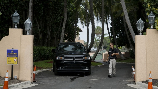 A member of US Secret Service at the entrance of former US President Donald Trump's house at Mar-A-Lago in Palm Beach, Florida, on Aug. 9. Photographer: Eva Marie Uzcategui/Bloomberg