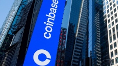 Monitors display Coinbase signage during the company's initial public offering (IPO) at the Nasdaq MarketSite in New York, on April 14, 2021. Photographer: Michael Nagle/Bloomberg