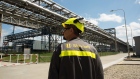 A worker walks at the Slovnaft Oil Refinery in Bratislava, Slovakia.