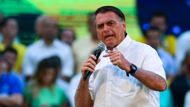 Jair Bolsonaro, Brazil's president, speaks during the National Convention to formalize his candidacy for a second term, at Maracanazinho Gymnasium in Rio de Janeiro, Brazil, on Sunday, July 24, 2022. Bolsonaro officially kicked off his re-election campaign on Sunday, rallying thousands of his followers to Rio de Janeiro, after intensifying his attempts to discredit Brazil's voting system.