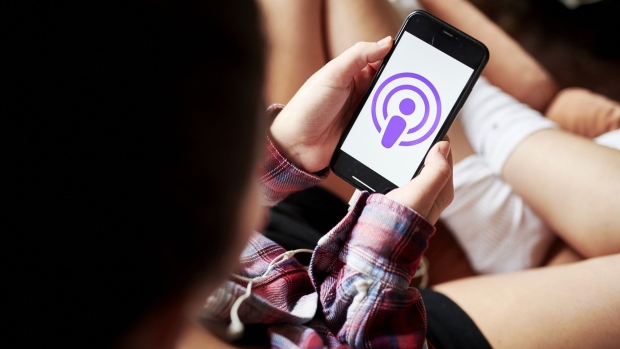 The logo for Apple Podcasts is displayed on a smartphone in an arranged photograph taken in the Brooklyn borough of New York, U.S., on Tuesday, Sept. 29, 2020. Record labels, streaming services and TV networks are all commissioning original podcast series, hoping to tap into the growing audience for on-demand audio.