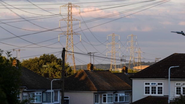 Electricity transmission towers near residential houses in Upminster, UK.