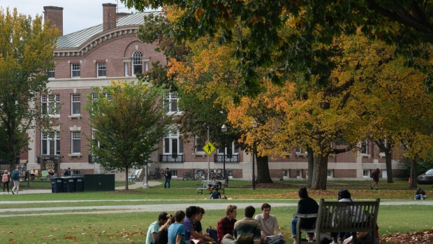 Students have class outdoors on the campus of Dartmouth College in Hanover, New Hampshire, U.S., on Friday, Oct. 15, 2021. Dartmouth College’s endowment returned 47% in the fiscal year that ended in June, the latest university to post some of the strongest investment gains in decades. Photographer: Bing Guan/Bloomberg