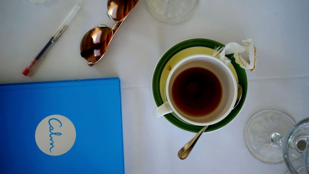 A copy of the manual for the new app "Calm," developed by Michael Acton Smith, chief executive officer of Mind Candy Ltd., sits next to a coffee cup on the conference table at the Saint John Hotel during the International Conclave of Entrepreneurs (ICE) MykonICE event in Mykonos, Greece, on Saturday, Sept. 17, 2016. With Brexit clouds arriving and the deluge of venture-capital cash drying up, the hard-drinking tech bros of London are turning to self-reflection and thinking harder than ever about their real priorities and new realities. Photographer: Loulou d'Aki/Bloomberg