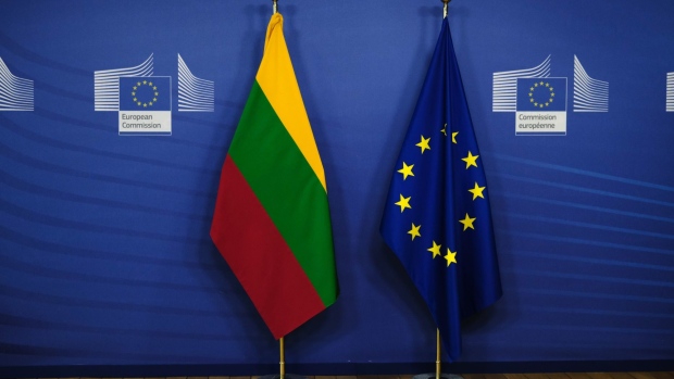 A Lithuanian national flag and a European Union (EU) flag ahead of a meeting between Lithuania's prime minister and the President of the European Commission, in Brussels, Belgium, on Thursday, June 3, 2021.  Photographer: Alexandros Michailidis/SOOC/Bloomberg